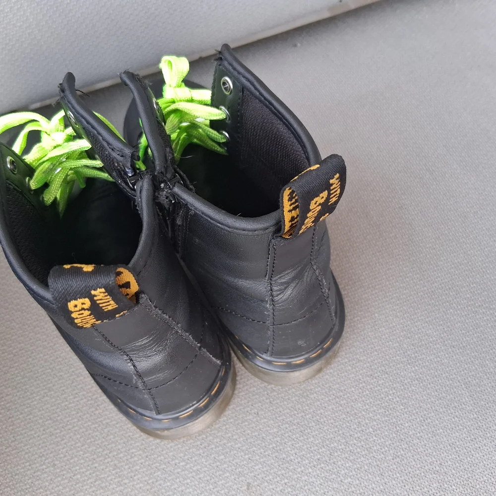 Dr. Martens Kids Black Boots with Bright Green Laces